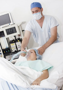 Anaesthetist at work with patient